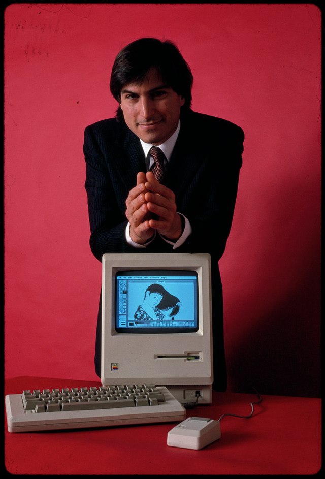 an image of steve jobs resting on a mac