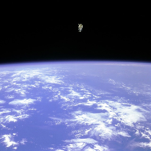 an astronaut in space above the atmosphere