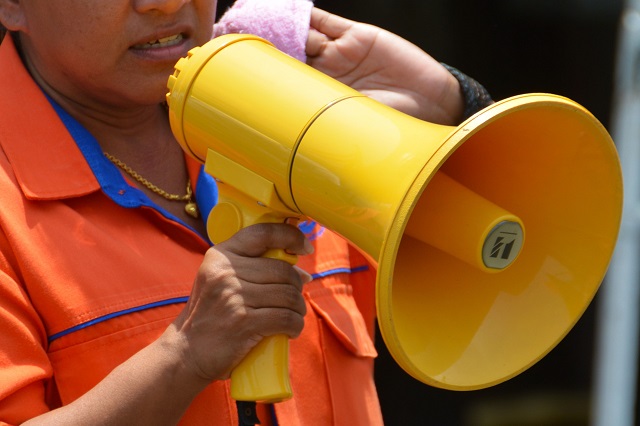 person speaking with a megaphone